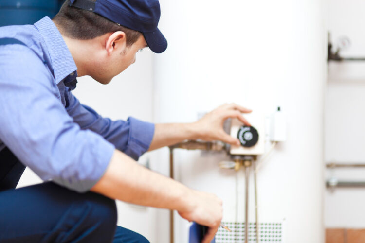 plumber,repairing,an,hot water,heater